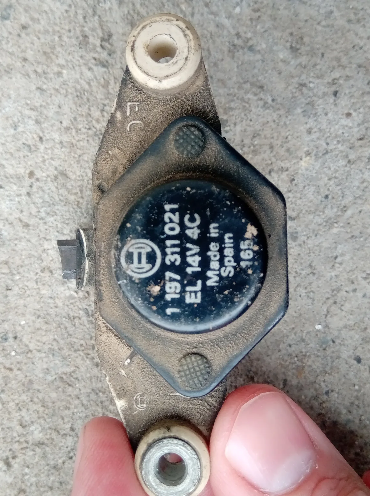 Bosch alternator voltage regulator with a worn carbon brush and 14-volt rating