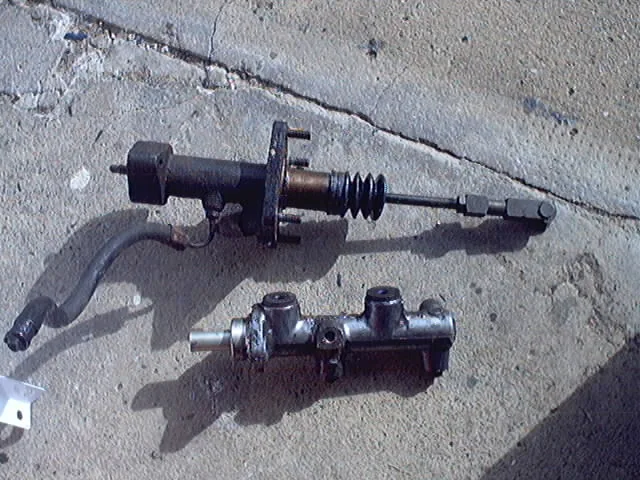 Hydraulic brake booster bolted to the master cylinder from an Audi 200 turbo, a pump-fed assist unit rather than a vacuum can