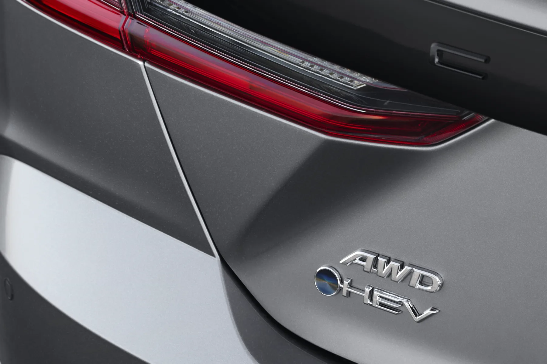 AWD and HEV badges on a 2025 Toyota Camry