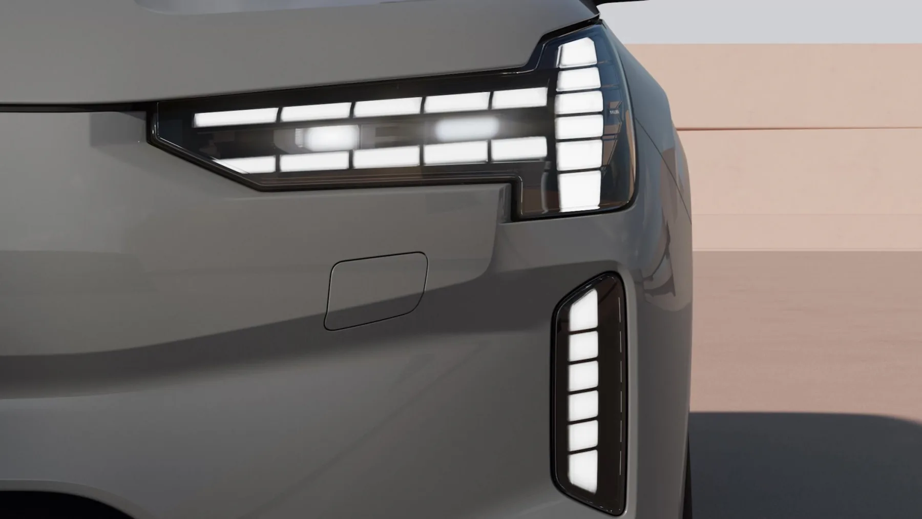 Close 2026 Volvo EX90 Thor’s Hammer lamp, T-shaped LED daytime graphic and a vertical corner stroke on a sealed fascia
