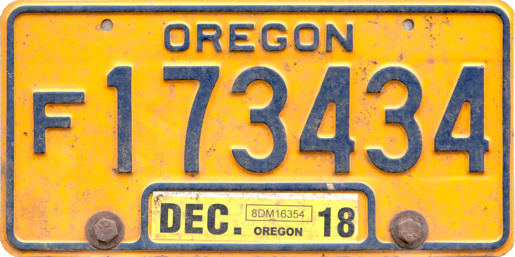 Oregon farm license plate with FARM lettering, an F-prefix number, a fir tree, and a December 2018 sticker