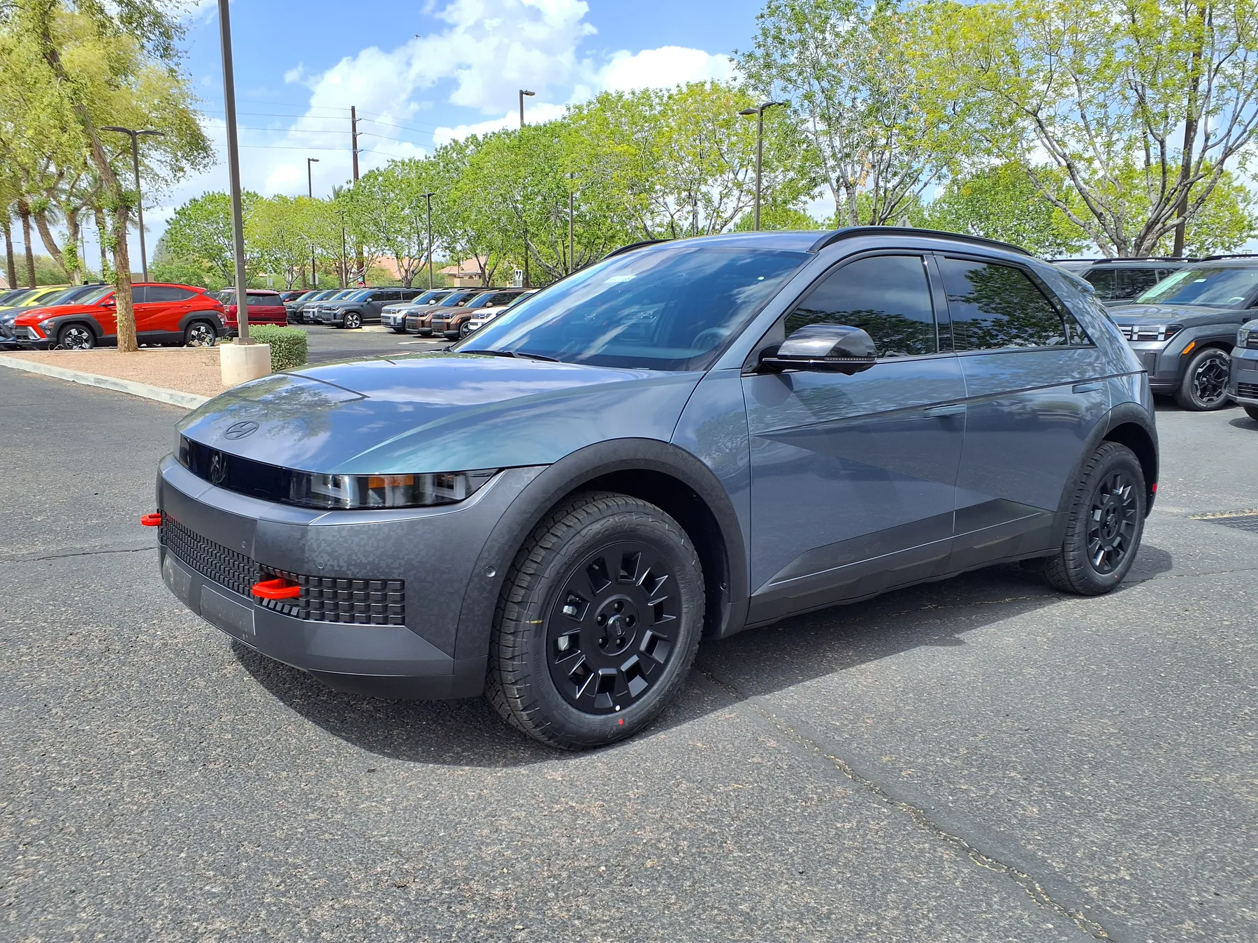 Grey 2025 Hyundai IONIQ 5 XRT on a dealer lot, illustrating the refreshed XRT design used for the 2026 model
