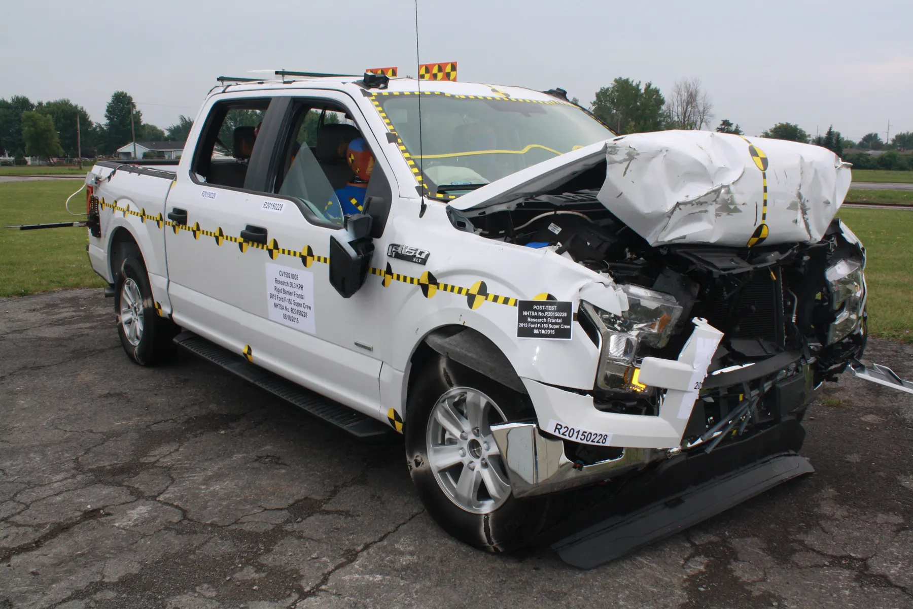 White pickup after an official NHTSA frontal crash test