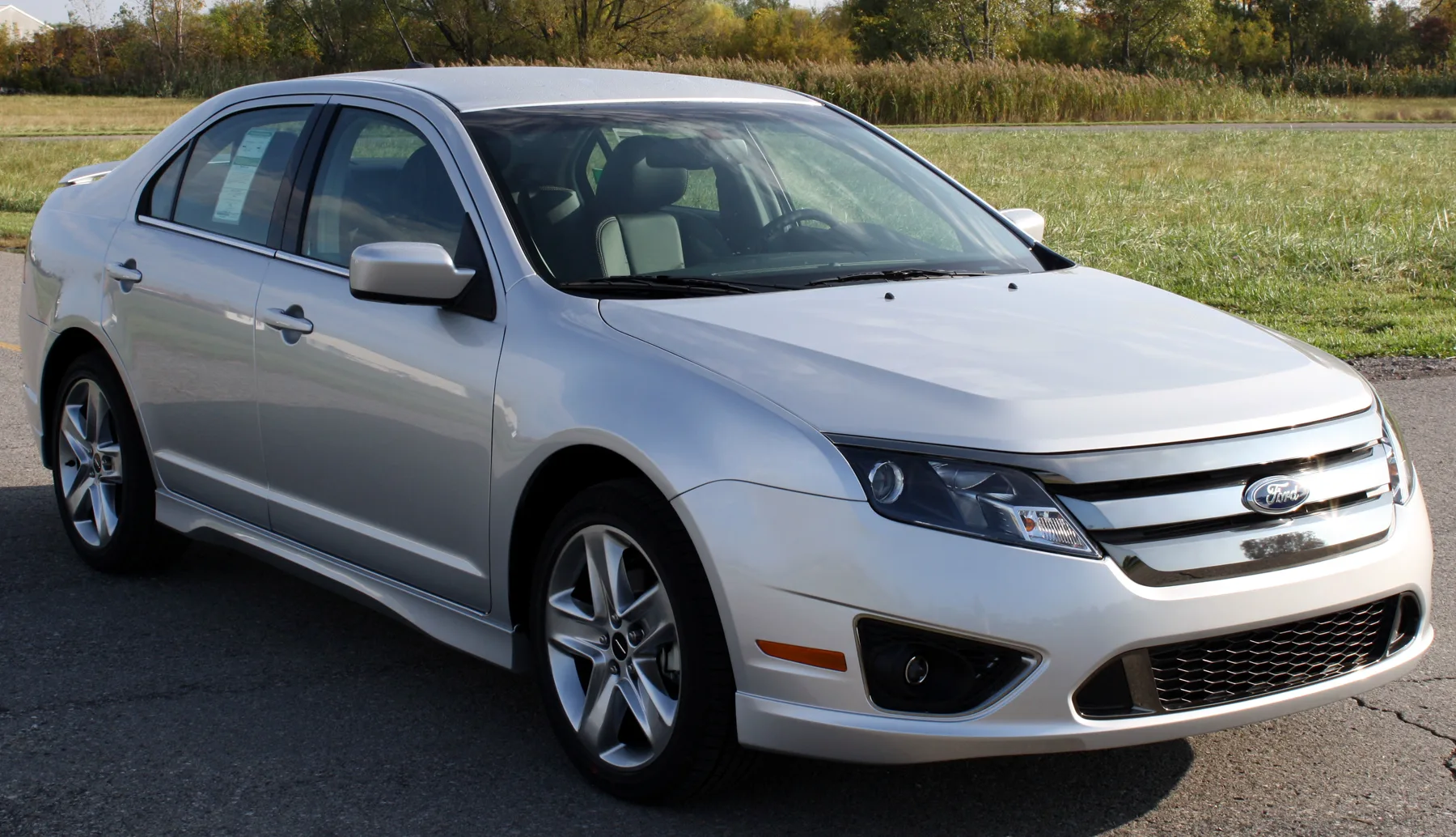 Silver Ford Fusion sedan in an official NHTSA test photograph