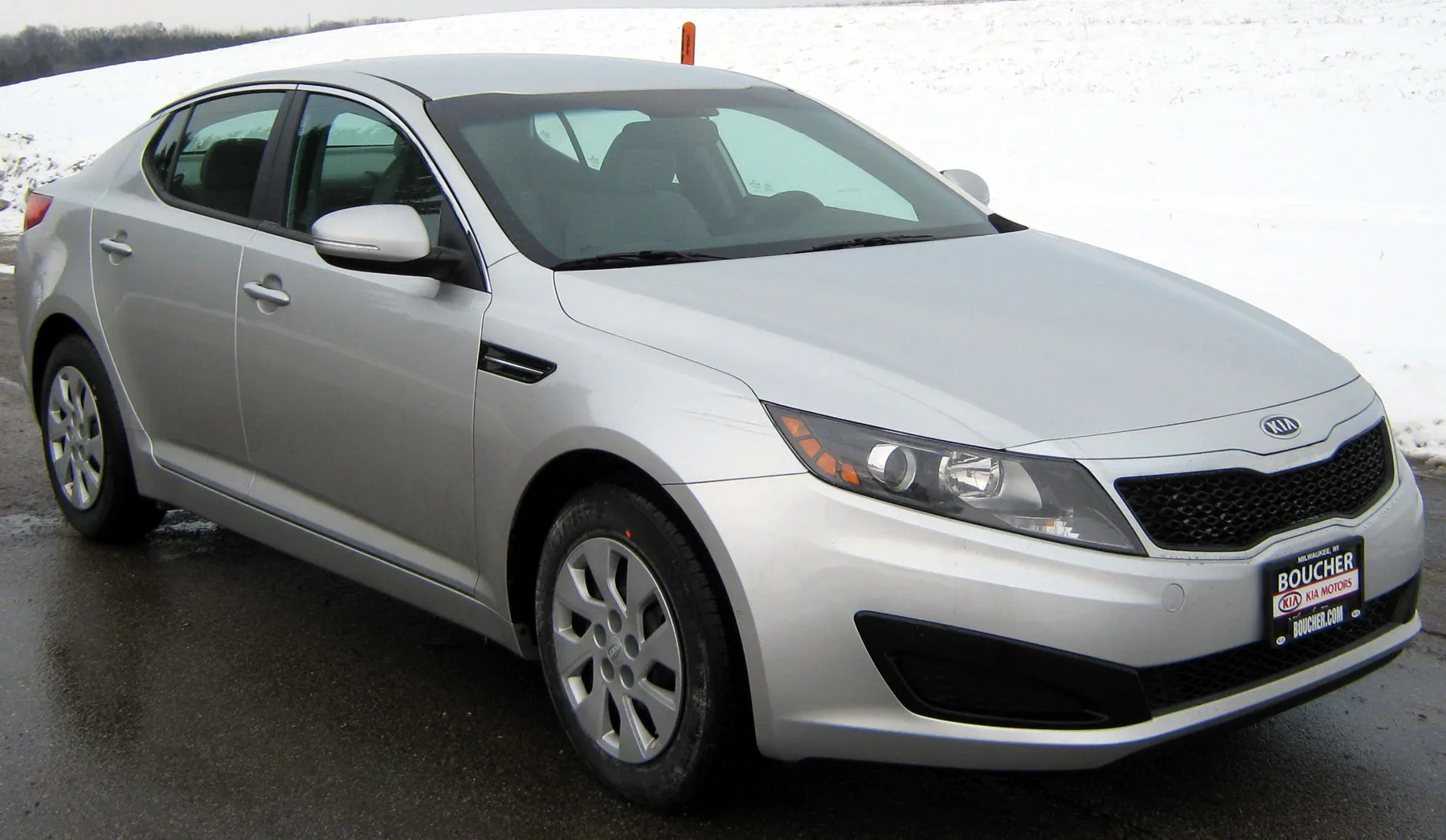 Silver Kia Optima sedan in an official NHTSA test photograph