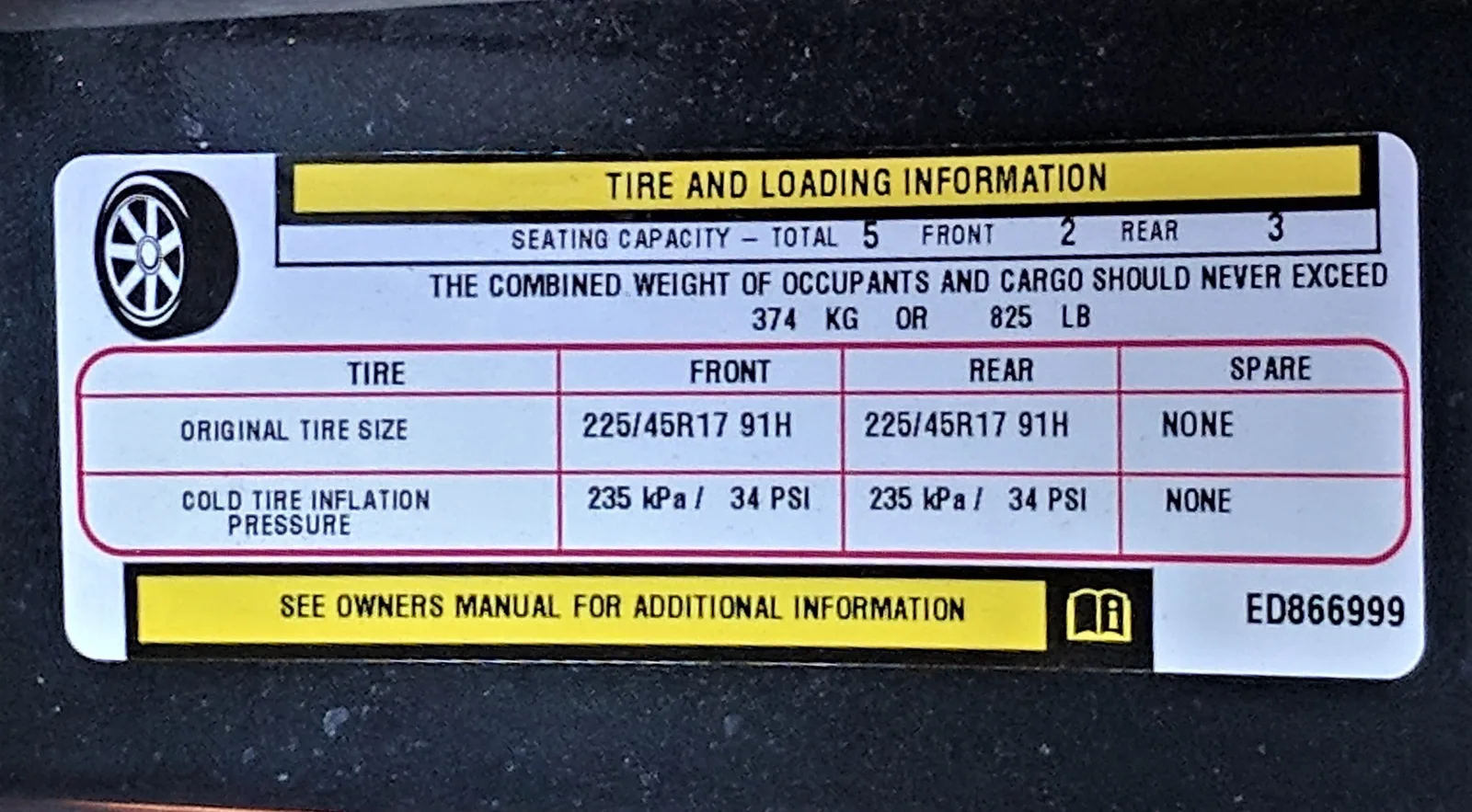 Dodge Dart driver's door jamb with a Tire and Loading Information placard listing cold tire pressures, occupant and cargo weight, seating, and tire size