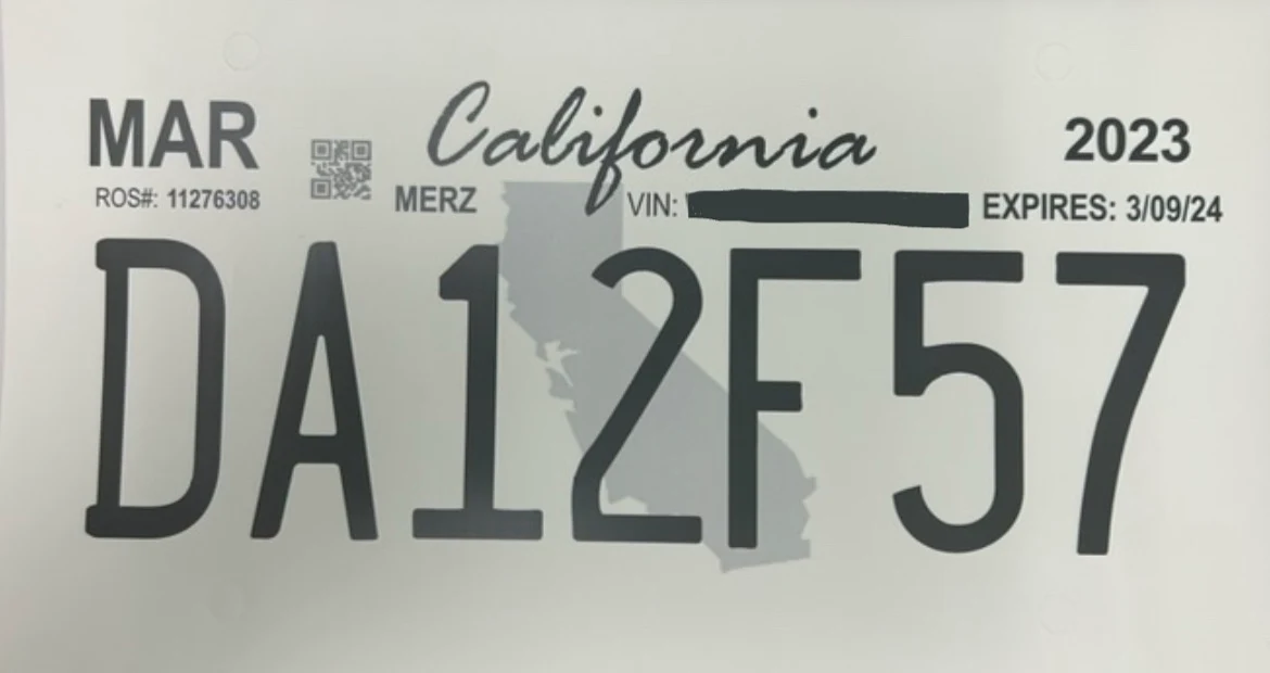 California temporary license plate on paper, expiration date and redacted VIN