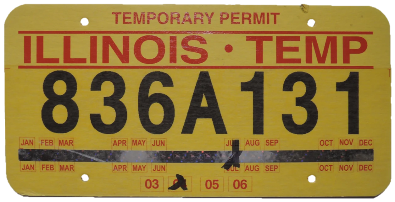 Yellow Illinois temporary permit with a punched month and year