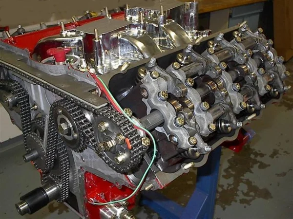 Ford FE SOHC with the timing chain on the cam sprocket and the rockers exposed