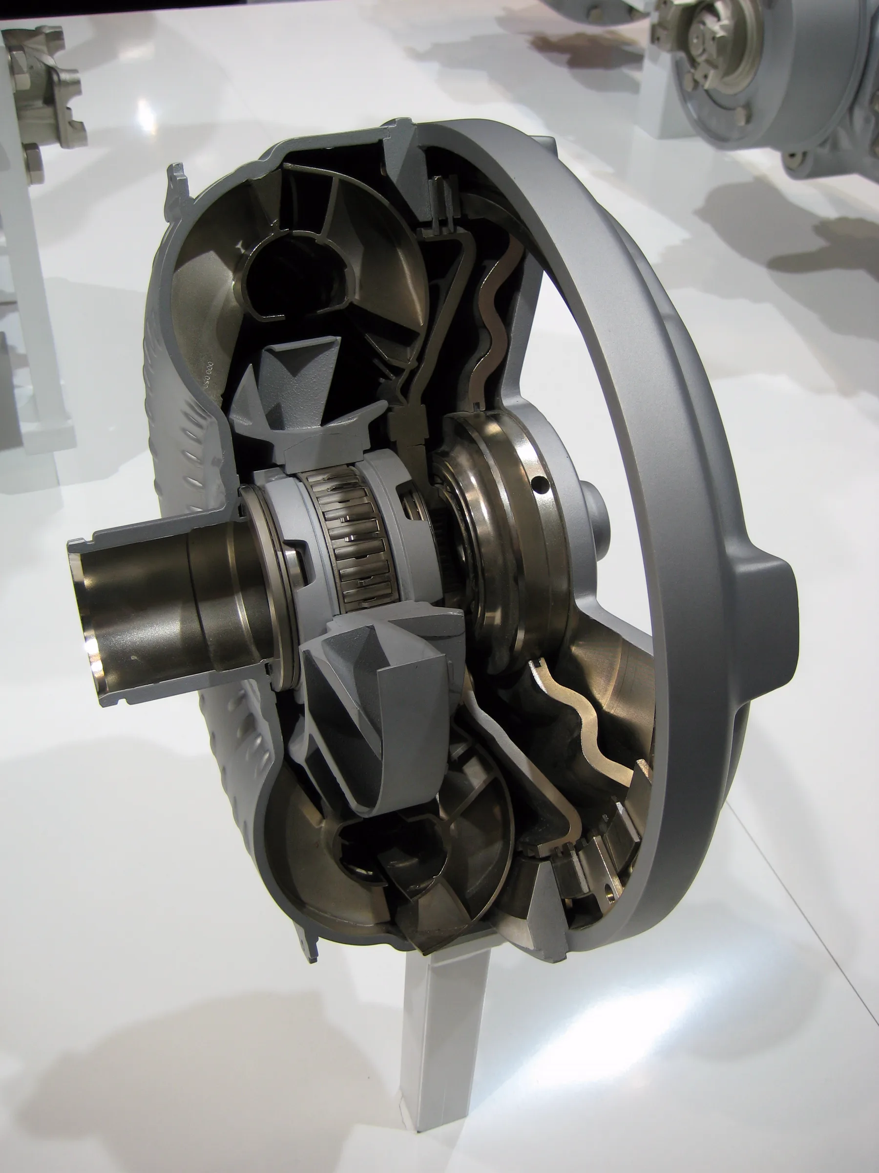 Cutaway of a ZF torque converter, the shell opened to show the bladed wheels inside