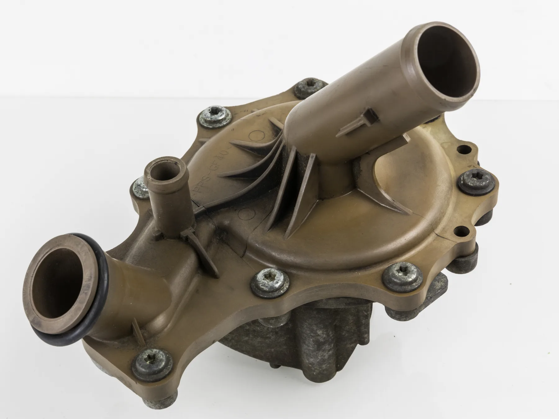 Automotive water pump body with a plastic housing, coolant ports, and a bolted metal base